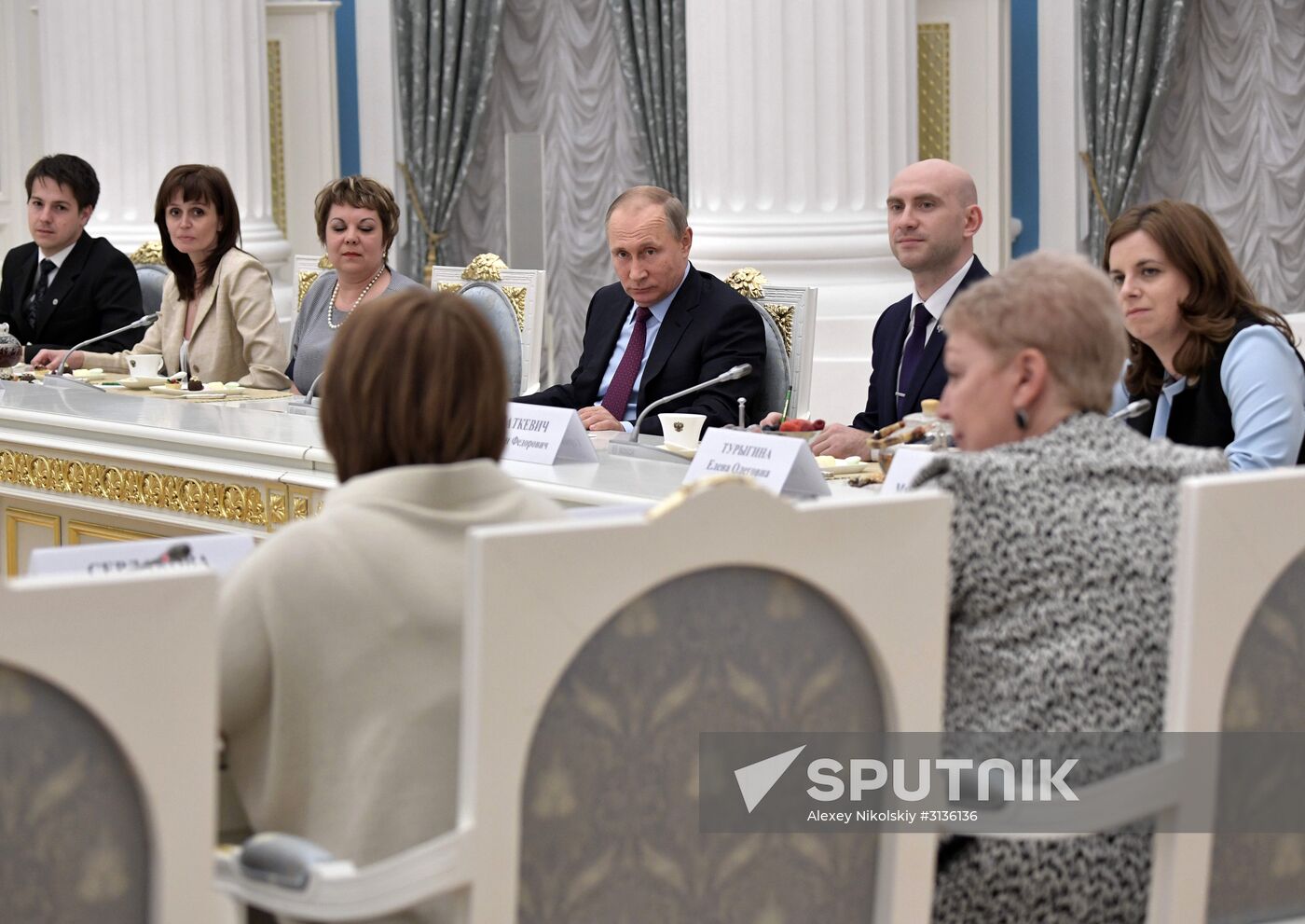 Russian President Vladimir Putin meets with graduating class teachers