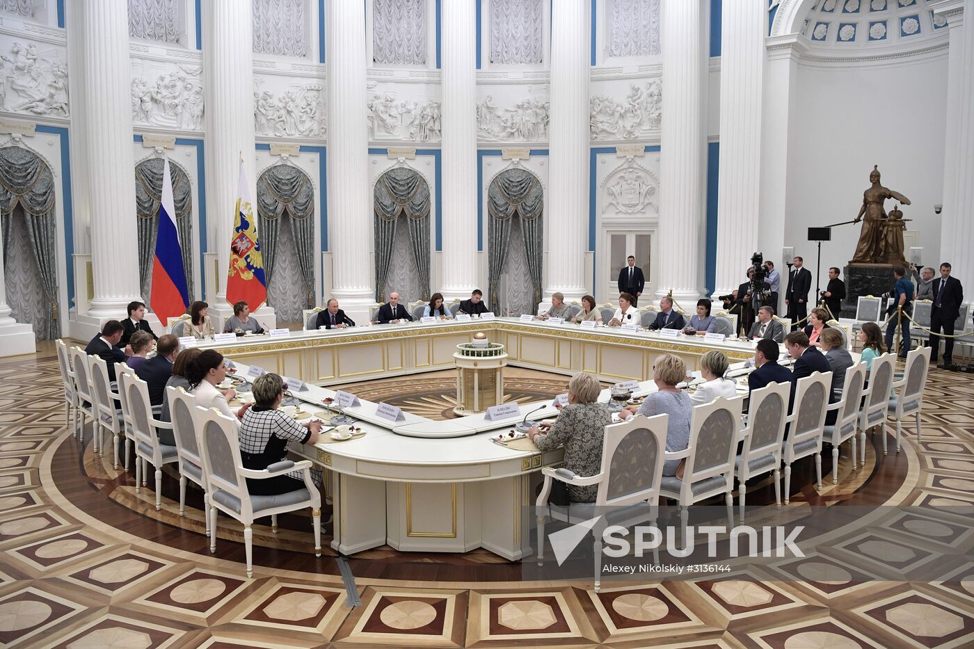 Russian President Vladimir Putin meets with graduating class teachers