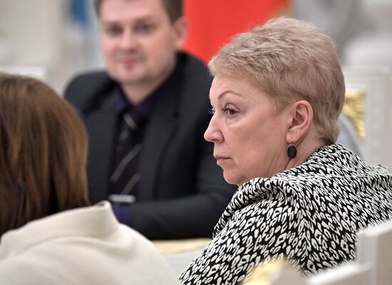 Russian President Vladimir Putin meets with graduating class teachers