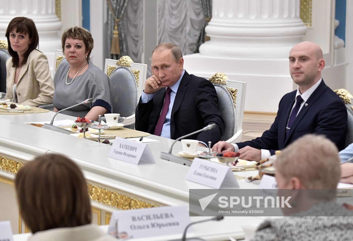 Russian President Vladimir Putin meets with graduating class teachers