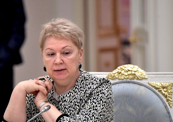 Russian President Vladimir Putin meets with graduating class teachers