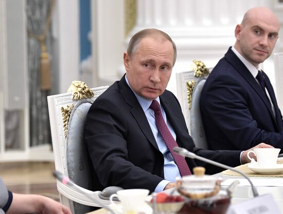 Russian President Vladimir Putin meets with graduating class teachers