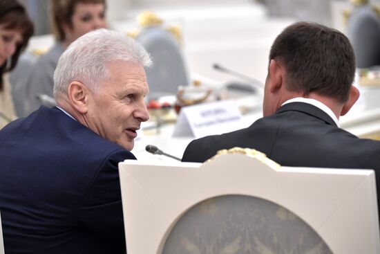 Russian President Vladimir Putin meets with graduating class teachers