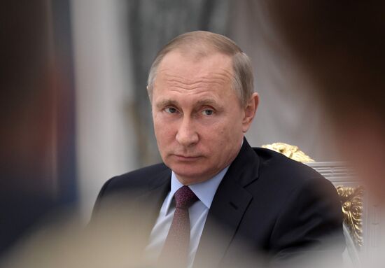 Russian President Vladimir Putin meets with graduating class teachers