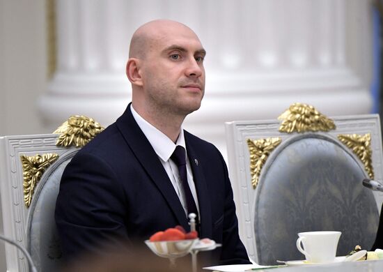 Russian President Vladimir Putin meets with graduating class teachers