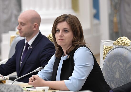 Russian President Vladimir Putin meets with graduating class teachers