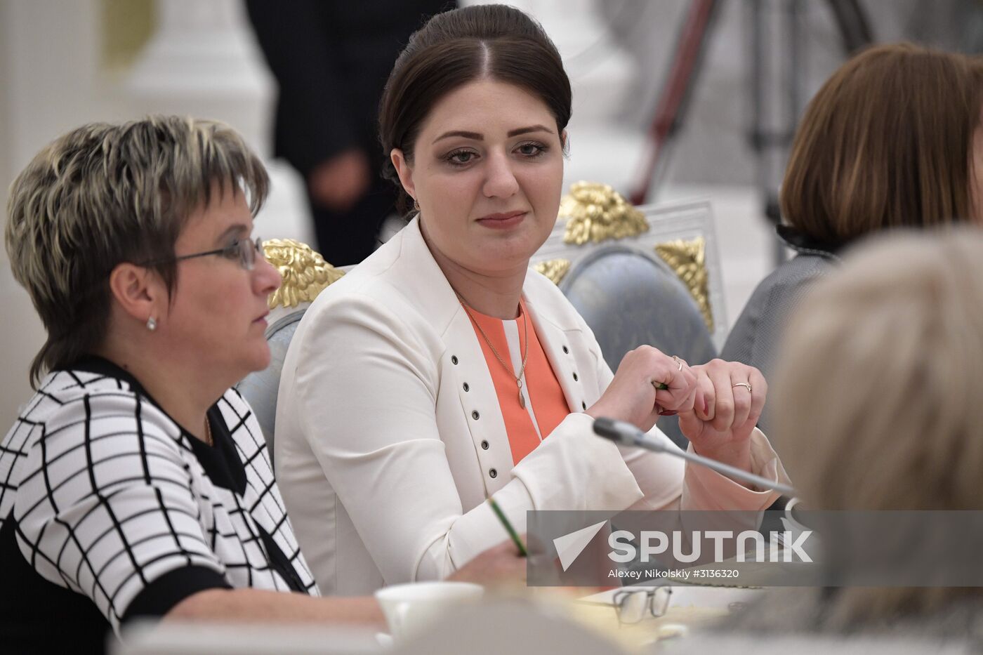 Russian President Vladimir Putin meets with graduating class teachers