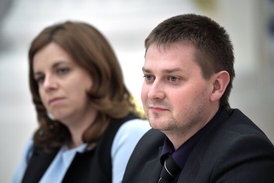 Russian President Vladimir Putin meets with graduating class teachers