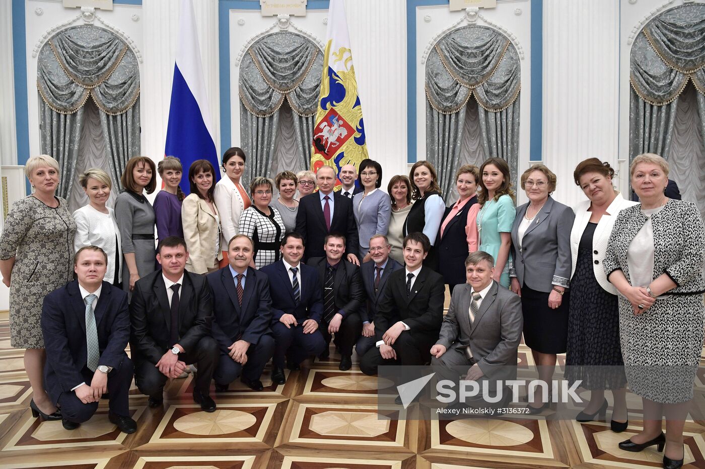 Russian President Vladimir Putin meets with graduating class teachers
