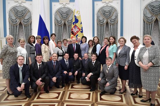Russian President Vladimir Putin meets with graduating class teachers