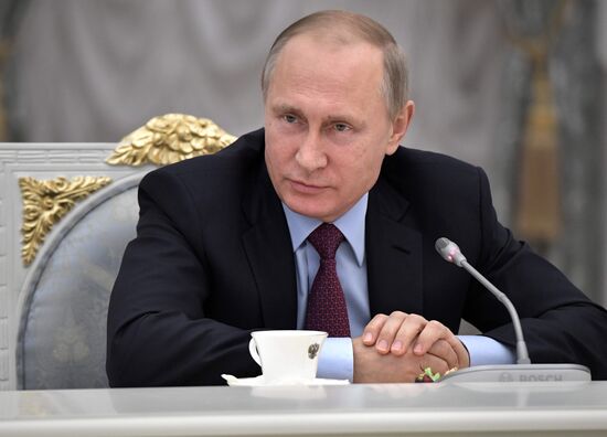 Russian President Vladimir Putin meets with graduating class teachers