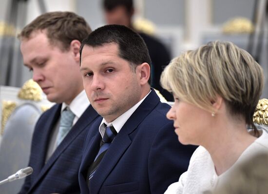 Russian President Vladimir Putin meets with graduating class teachers