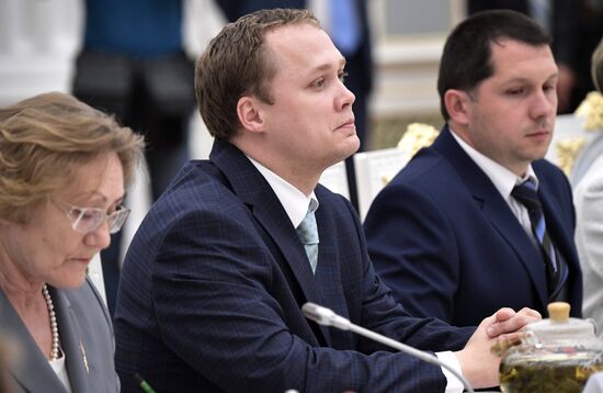 Russian President Vladimir Putin meets with graduating class teachers