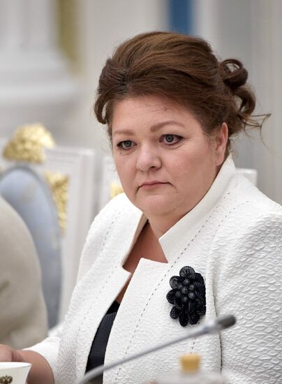 Russian President Vladimir Putin meets with graduating class teachers