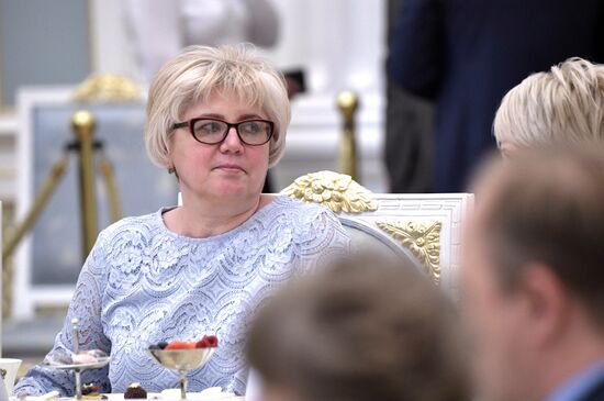 Russian President Vladimir Putin meets with graduating class teachers