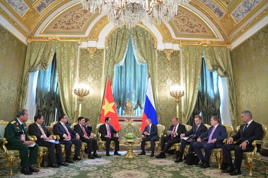 Russian President Vladimir Putin meets with President of Vietnam Tran Dai Quang