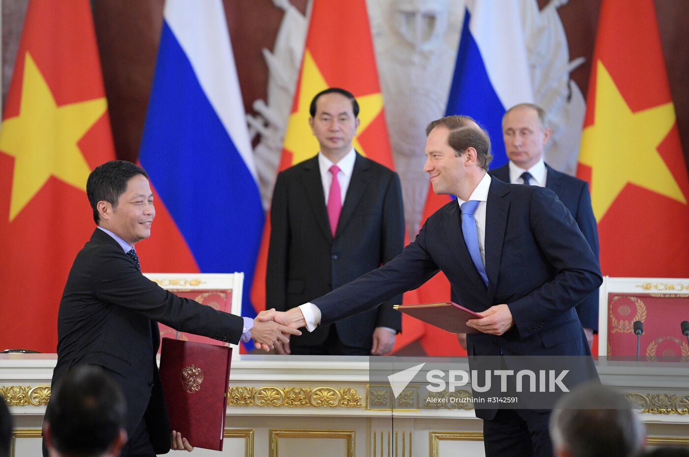 Russian President Vladimir Putin meets with Vietnamese President Tran Dai Quang