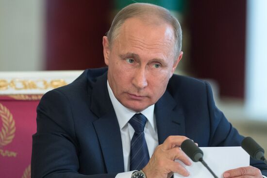 Russian President Vladimir Putin meets with Vietnamese President Tran Dai Quang