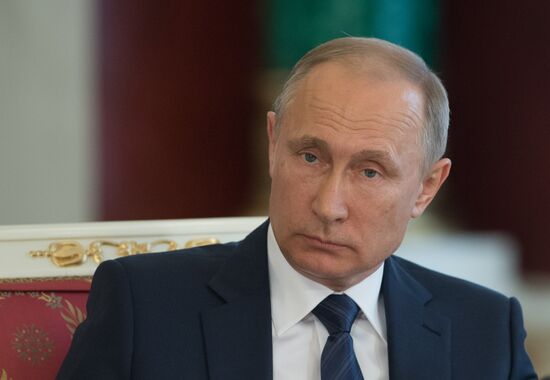 Russian President Vladimir Putin meets with Vietnamese President Tran Dai Quang