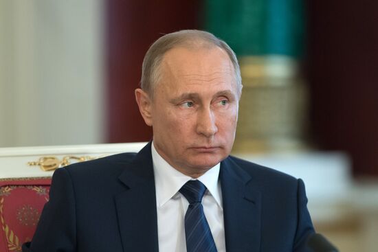 Russian President Vladimir Putin meets with Vietnamese President Tran Dai Quang