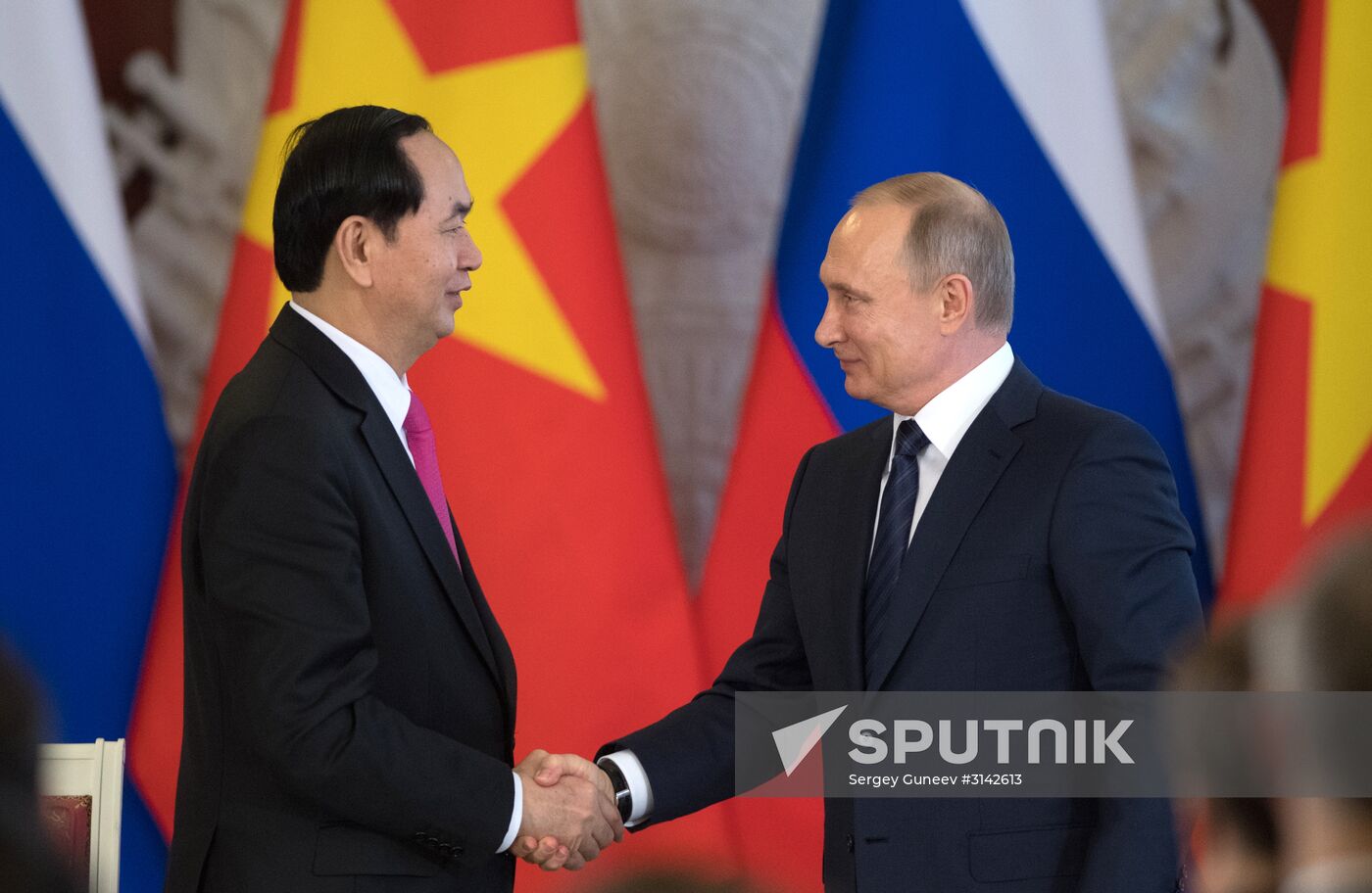 Russian President Vladimir Putin meets with Vietnamese President Tran Dai Quang