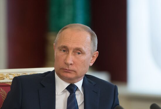 Russian President Vladimir Putin meets with Vietnamese President Tran Dai Quang
