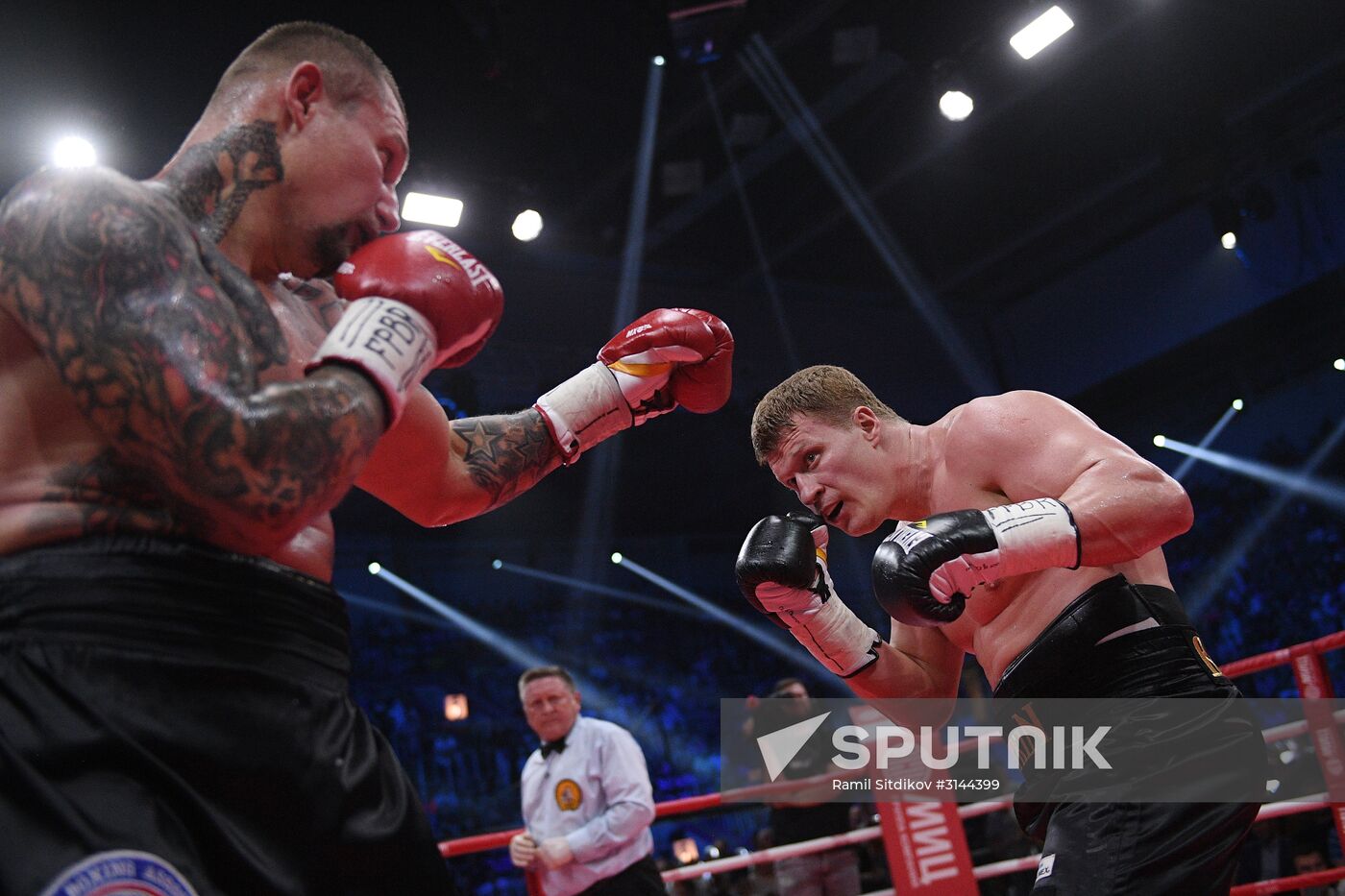 From right: Russia's Alexander Povetkin and Ukraine's Andriy Rudenko in the WBO International and WBA International title bout at the Rossiya Concert Hall in Moscow. Location: Russia, Moscow. Author: Ramil Sitdikov/Sputnik. Boxing. Alexander Povetkin vs. Andriy Rudenko