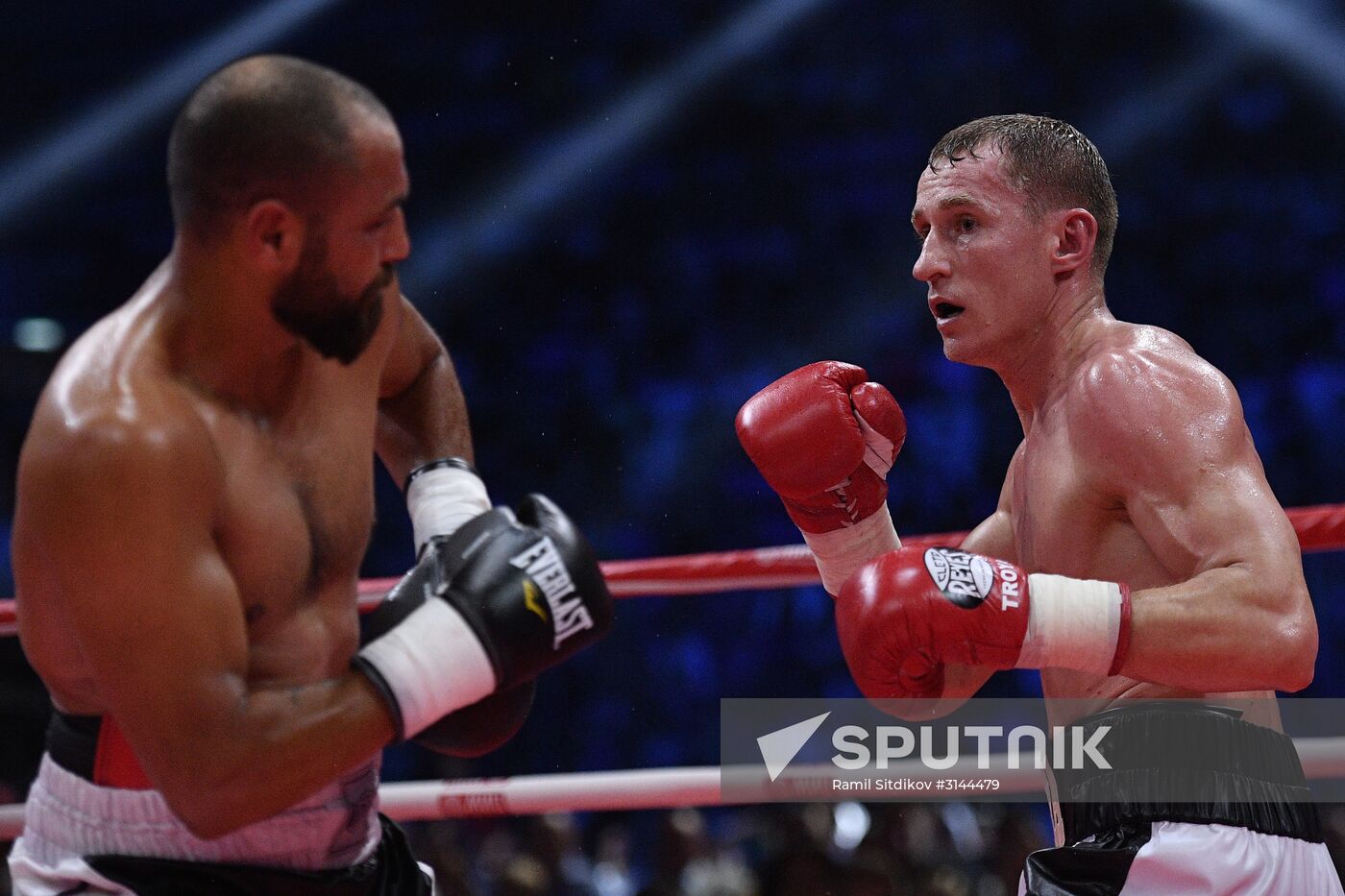 From right: Russia's Eduard Troyanovsky and Italy's Michele di Rocco during an undercard prior to a title bout against between Russia's Alexander Povetkin and Ukraine's Andriy Rudenko at the Rossiya Concert Hall in Moscow. Location: Russia, Moscow. Author: Ramil Sitdikov/Sputnik. Boxing. Alexander Povetkin vs. Andriy Rudenko