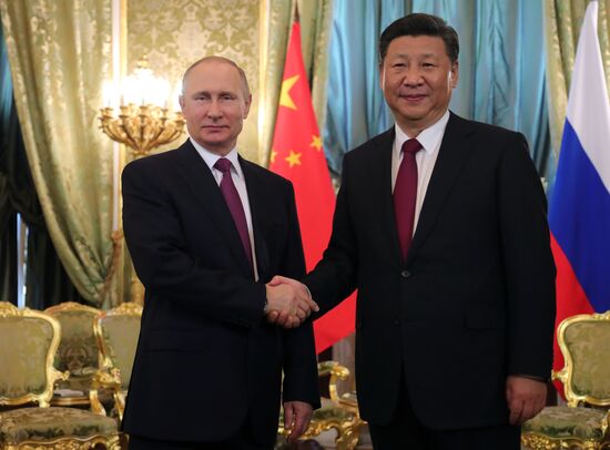 Vladimir Putin meets with Xi Jinping in Moscow