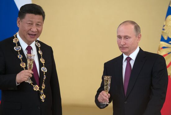 Vladimir Putin meets with Xi Jinping in Moscow