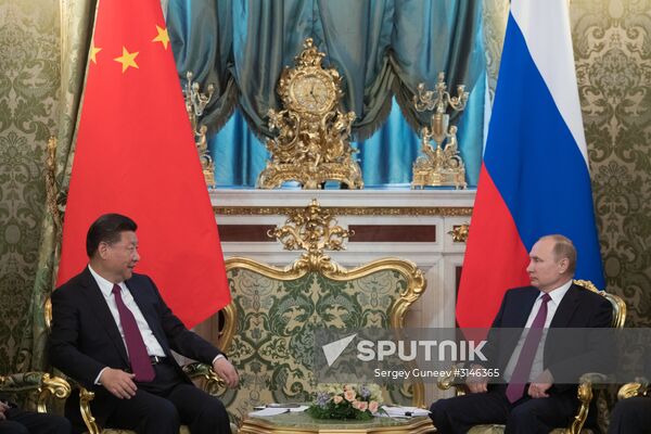 Vladimir Putin meets with Xi Jinping in Moscow