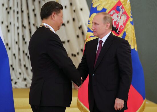 Vladimir Putin meets with Xi Jinping in Moscow