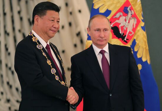 Vladimir Putin meets with Xi Jinping in Moscow