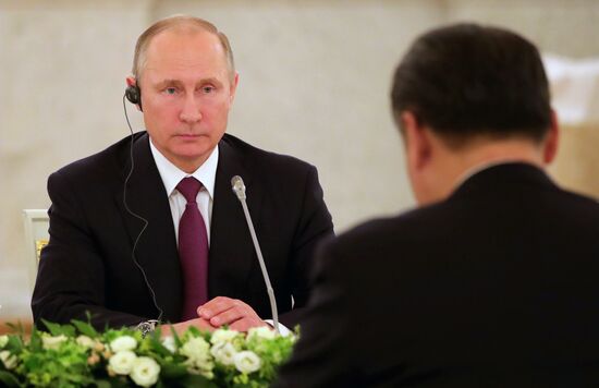 Russian President Vladimir Putin meets with Xi Jinping in Moscow