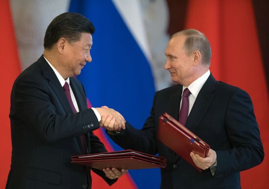 Vladimir Putin meets with Xi Jinping in Moscow