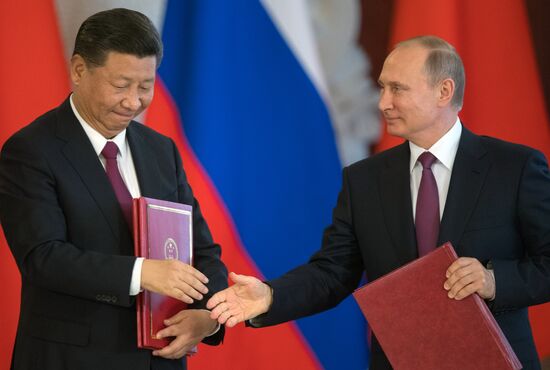 Vladimir Putin meets with Xi Jinping in Moscow