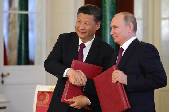 Vladimir Putin meets with Xi Jinping in Moscow