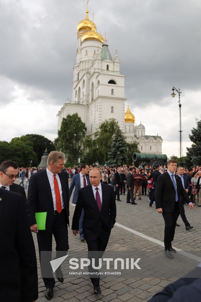 Russian President Vladimir Putin walks around the Moscow Kremlin