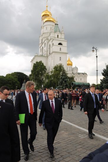 Russian President Vladimir Putin walks around the Moscow Kremlin