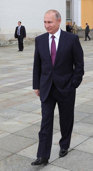 Russian President Vladimir Putin walks around the Moscow Kremlin