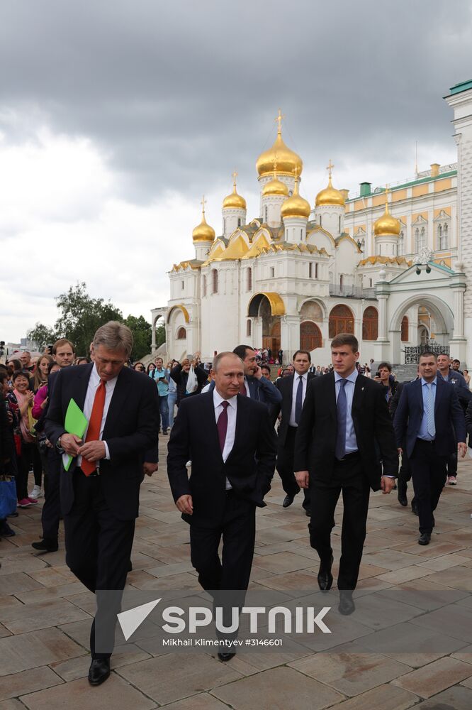 Russian President Vladimir Putin walks around the Moscow Kremlin