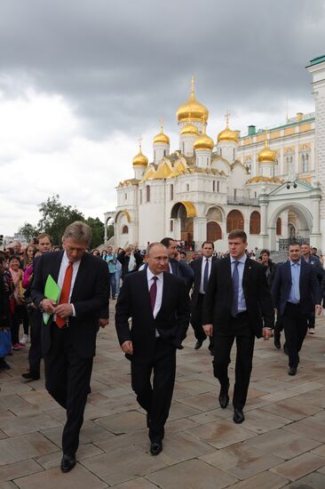 Russian President Vladimir Putin walks around the Moscow Kremlin