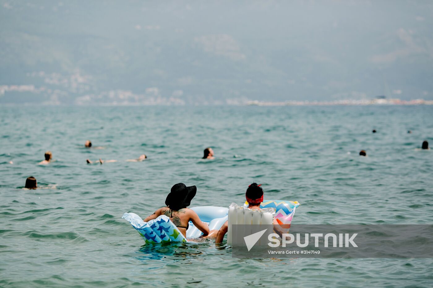 Vacationers on Mogren Beach located at the foot of steep slopes 500m away from the historic center of Budva in Montenegro. Location: Montenegro, . Author: Varvara Gert'e/Sputnik. Countries of the world. Montenegro