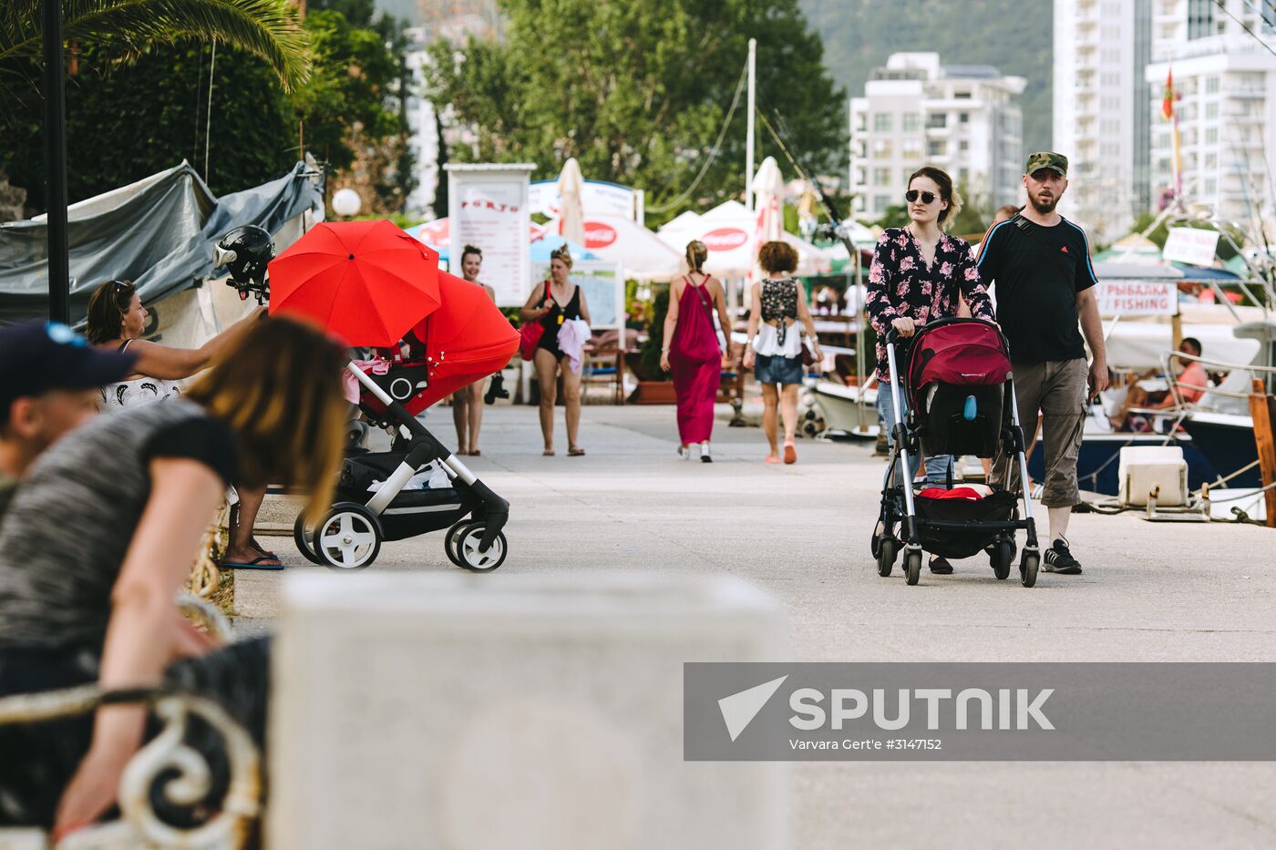 Tourists at the quay of the Adriatic Sea in Budva. Location: Montenegro, Budva. Author: Varvara Gert'e/Sputnik. Countries of the world. Montenegro