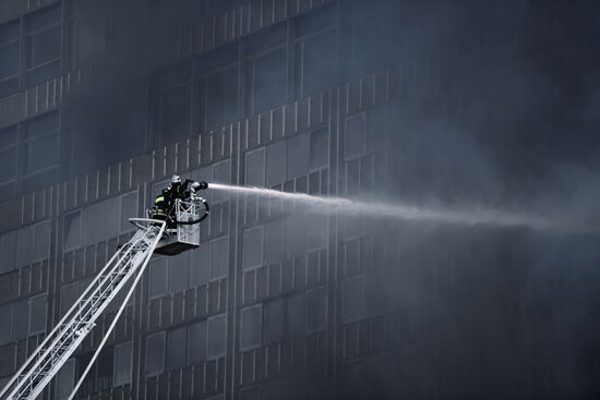 Fire sweeps skyscraper on Moscow's Novy Arbat Street