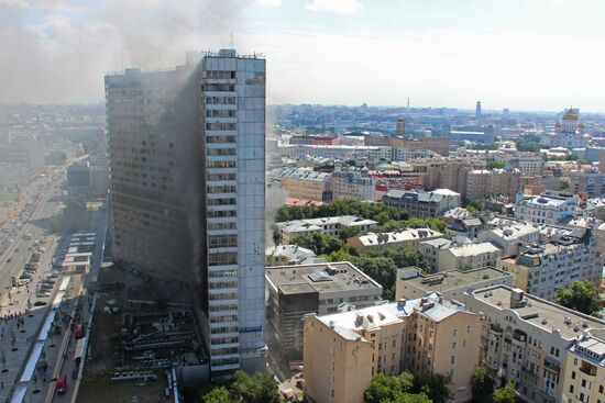 Fire sweeps skyscraper on Moscow's Novy Arbat Street