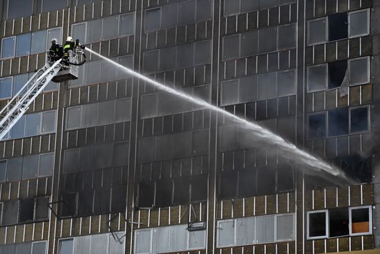 Fire sweeps skyscraper on Moscow's Novy Arbat Street