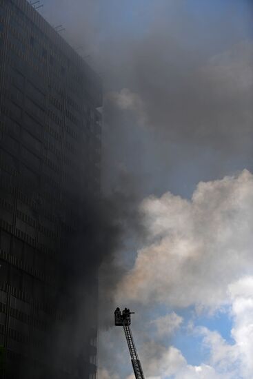 Fire sweeps skyscraper on Moscow's Novy Arbat Street