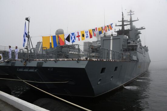 Raising St. Andrew's flag aboard Sovershenny corvette in Vladivostok