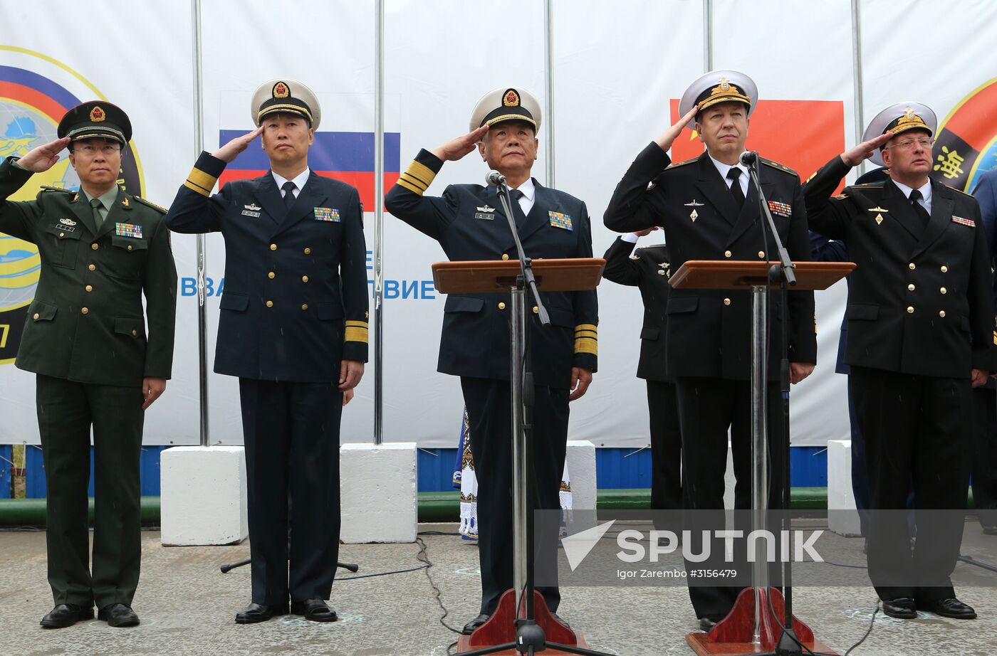Vice-Admiral Alexander Fedotenkov, Deputy Commander of the Russian Navy, second right, and Vice-Admiral Tian Zhong, Deputy Commander of the Chinese Navy, center, at a greeting ceremony for the Chinese Navy warships that arrived in Baltiysk for the 2017 Naval Cooperation Russia-China drills. Location: Russia, Kaliningrad Region, Baltiysk. Author: Igor Zarembo/Sputnik. Three Chinese Navy ships arrive in Baltiysk